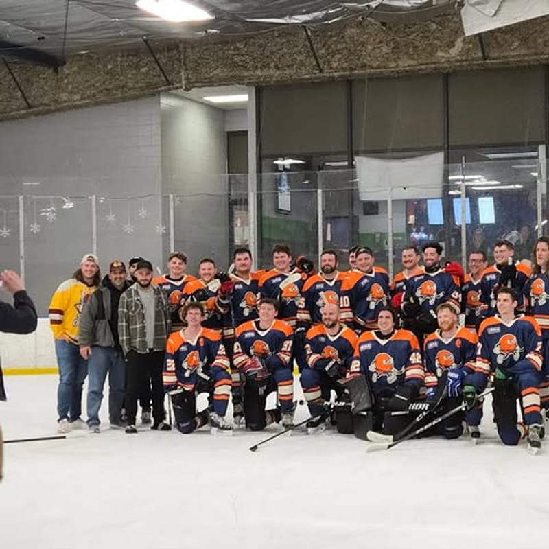 IBHA team gathered on the rink for a group photo