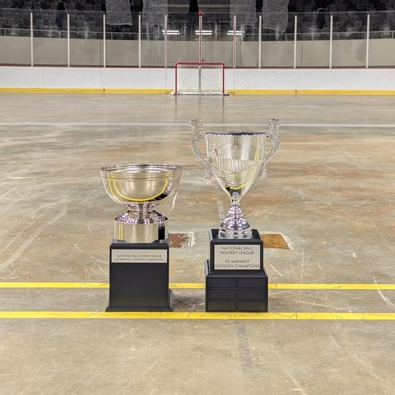 Championship trophies displayed on the ball hockey rink