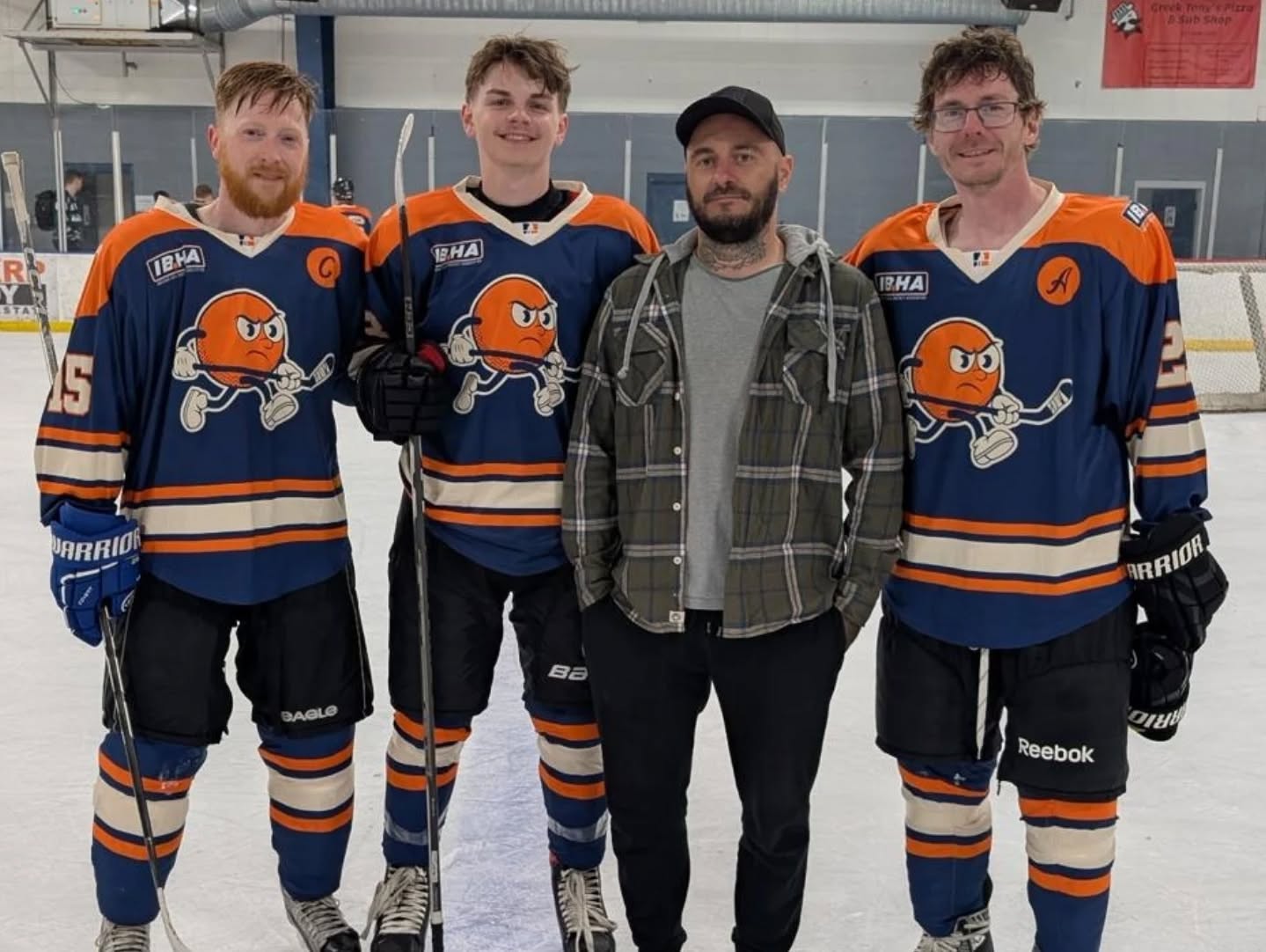 IBHA players posing together on the rink
