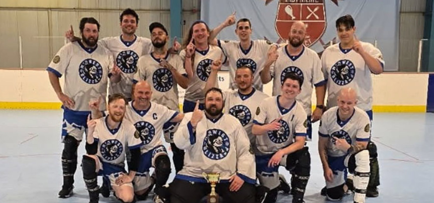Ball hockey players competing on the rink