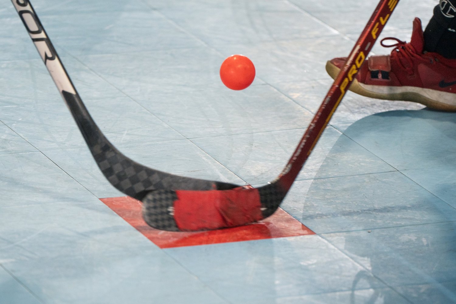 Ball hockey players competing at Ellenberger Park