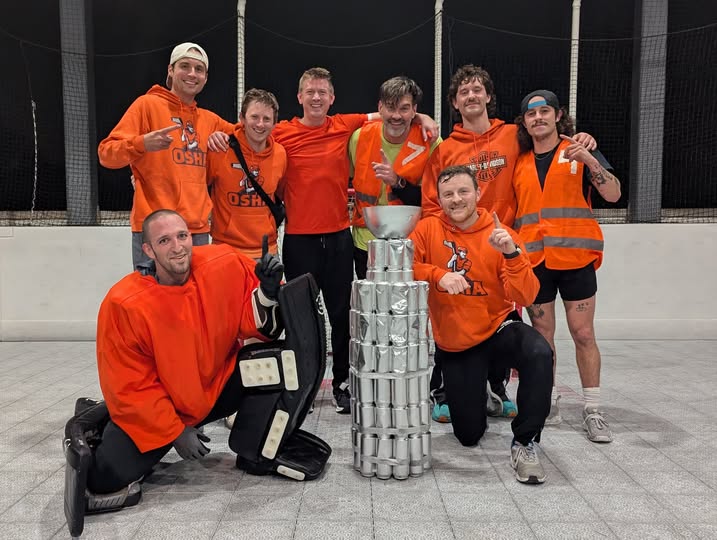 Rooftop league champions celebrating with the trophy